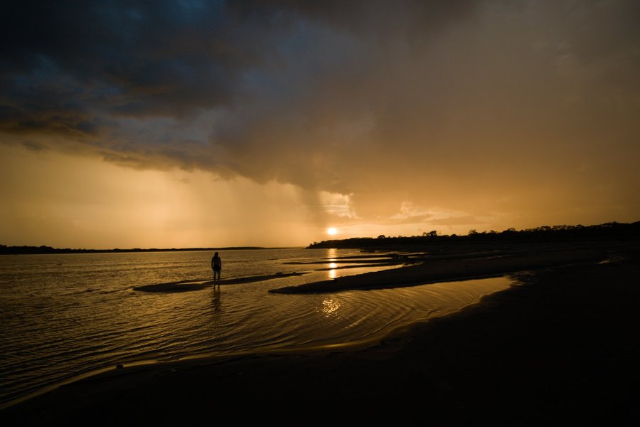 Sunset with rain on the Ucayali River, Peru.